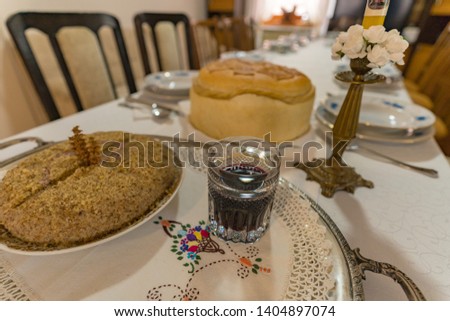 Wine, boiled wheat and domestic bread put on the table as a part of a Christian tradition Royalty-Free Stock Photo #1404897074