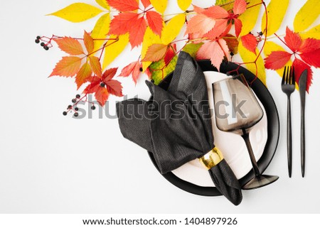Festive table setting with Bright Autumn leaves on white background. Flat lay, top view