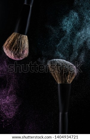 Make up brushes making the particles in air
