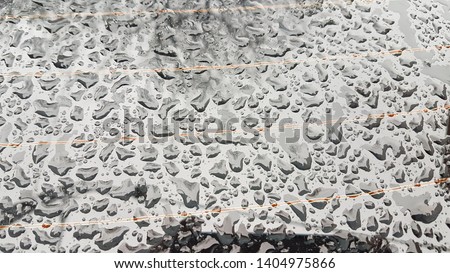Waterdrops on a grey surface