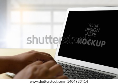 Mockup of business man using laptop screen for your advertising text message