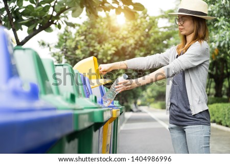 Recycle rubbish waste management people, Woman separate plastic bottle to container recycle bin. Waste separation rubbish to garbage bin, environment care pollution trash recycling management concept. Royalty-Free Stock Photo #1404986996
