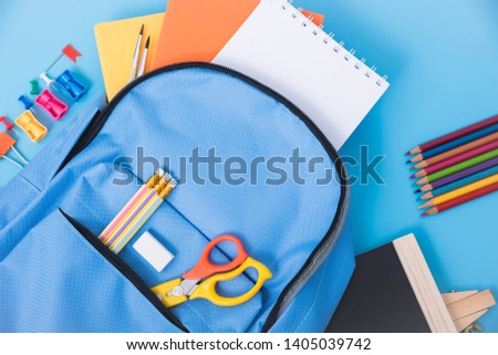 Top view Blue bag backpack for education children on blue background back to school concept