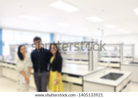 Graduate student in science laboratory of college blurred image for background. Education master’s degree or doctoral degree concept.