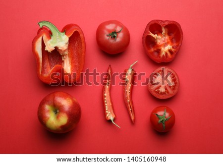 Flat lay composition with fresh ripe vegetables on color background