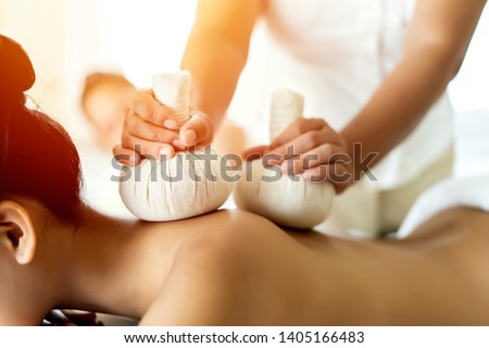 Beautiful young Asian woman relaxing during full body massage at spa environment, Leisure. lifestyle beauty woman concept Royalty-Free Stock Photo #1405166483