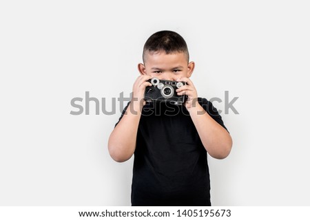 Kid photographer take a photo 