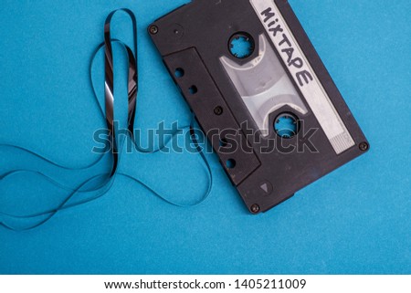 cassette tape isolated against blue background