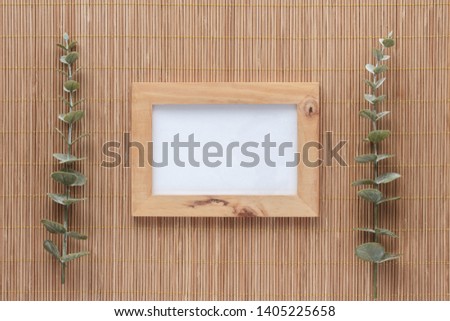 Photo frame on bamboo background. Top view with copy space for your text. Flat lay. 
