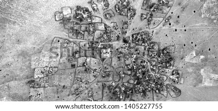 naif village, allegory, abstract naturalism, Black and white photo, abstract photography of landscapes of the deserts of Africa from the air, aerial view, contemporary photographic art,