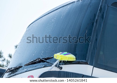 Washing the windshield on the bus