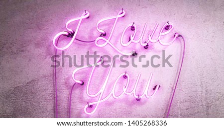 Neon sign saying I love you in bright pink