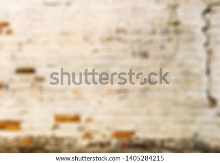Unfocused, Blur phototography. Texture of a cracked brick wall. Background
