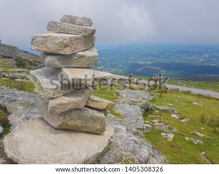 cairn (Inukshuk rocks) at the top of La Rhune mountain in the Atlantic Pyrenees. Border between Spain and France.