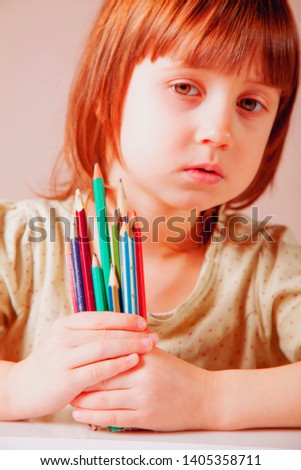 Cute little child girl with colored pencils. Art, creative, talent, education,  happy childhood concept.