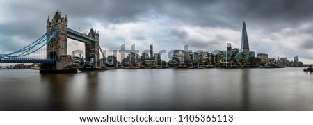 The skyline of London during a cloudy afternoon: from the Tower Bridge to London Bridge