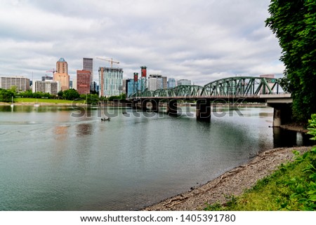 panoramic view of Portland Oregon USA skyline from the Hawthorne Bridge on the Willamette River shore
