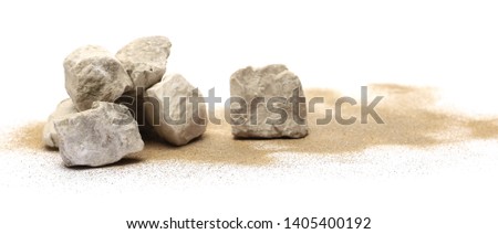 Rocks in sand pile isolated on white background and texture Royalty-Free Stock Photo #1405400192