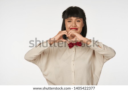 Woman smiling hands with heart signs                              