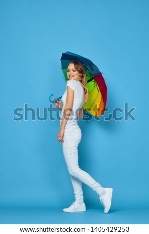 woman holding a beautiful umbrella from the rain                               