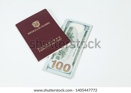 travel concept, Colombian passport with dollar bills for travel abroad