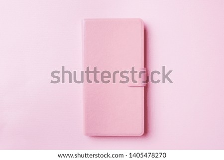 Pink pastel color of phone case on colorful background.
