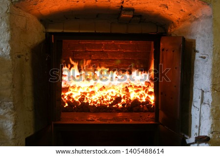 Peat fire in a whisky distillery kiln  Royalty-Free Stock Photo #1405488614