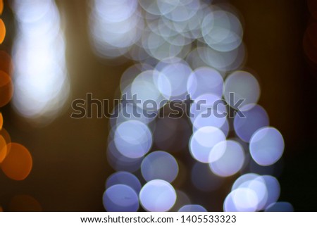Multi-colored bokeh, spherical shape, there are many hidden overlaps on a black background.