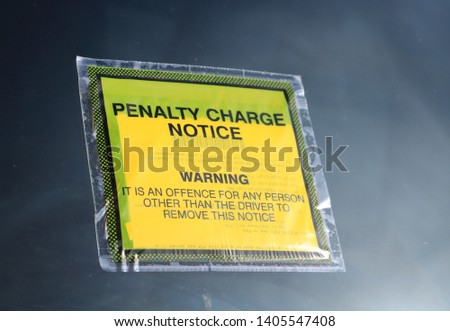Parking fine notice attached to a car windscreen. Known also as a PCN or Parking Charge Notice or Parking Ticket. 