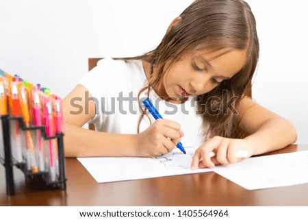 Children Education Concept, Cute Girl Sitting at his Desk Painting