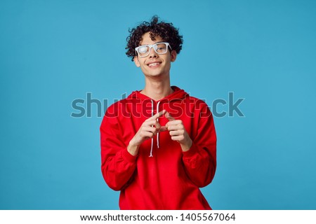 african man wearing glasses smiling signs on blue background                              