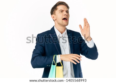 business man in a suit with bags in his hands office holiday shopping