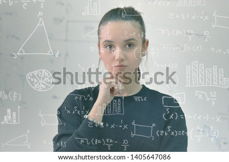 Young female student in math class overwhelmed by the math formula. Pressure, Education, Success concept. Royalty-Free Stock Photo #1405647086