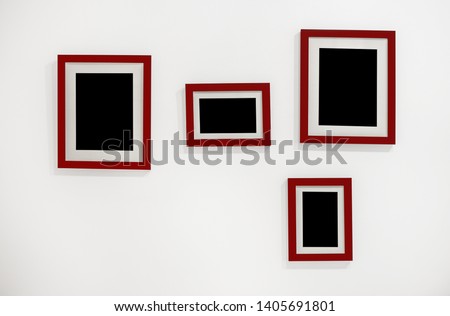Stock for mockup. Red frames with mat for photos or paintings. Frames hang on the wall.