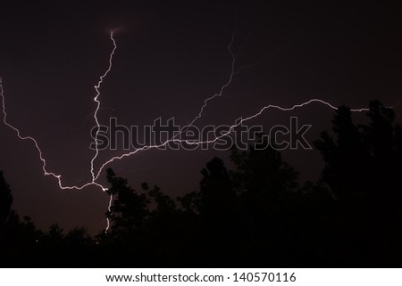 White lightning during summer storm at night 