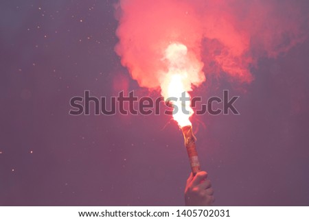 Fire torch from a football supporter Royalty-Free Stock Photo #1405702031
