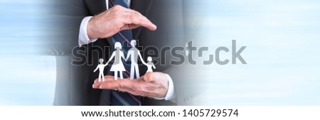 Concept of family insurance with hands protecting a family. panoramic banner
