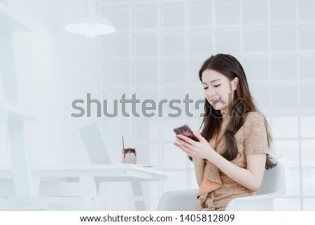 Asian business woman working in in coffee shop cafe with laptop. Business woman concept.