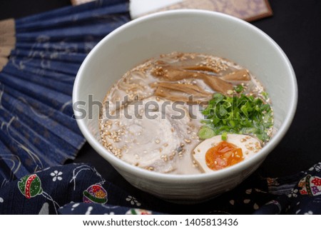 Delicious tonkotsu miso ramen noodles with pork and egg - japanese style. White bowl.