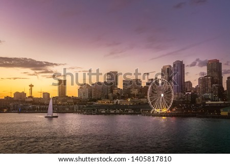 Beautiful Seattle waterfront skyline from Elliott Bay at dusk. Dreamy cityscape or scenery. Washington state, USA. Royalty-Free Stock Photo #1405817810