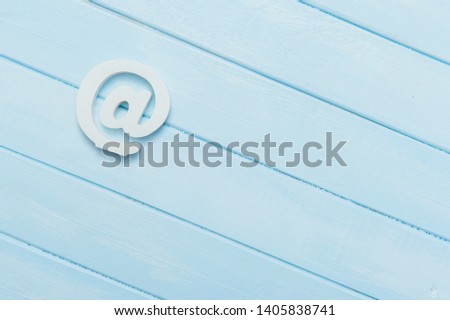 e-mail symbol on wooden background with copy space
