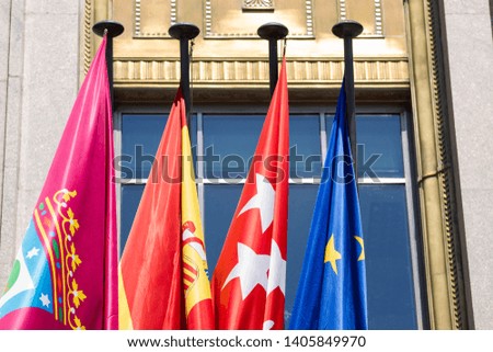 Madrid flag, community flag, flag of Spain and flag of Europe.
