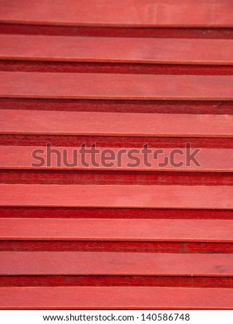 Texture of red weathered wooden lining boards with gap. Selective focus and shallow depth of field.
