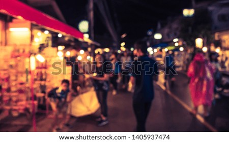 Vintage tone Abstract Blurred Street night market with bokeh for background usage.