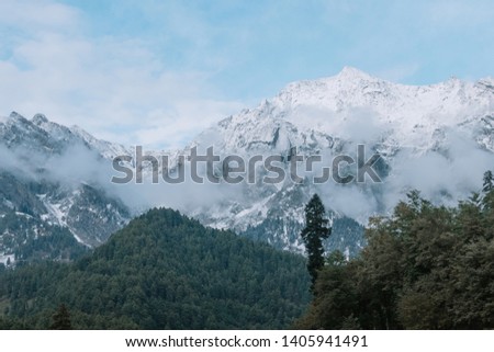 Mountain with full of snow at Pahalgam. Image may contains noise and a bit blur due to low light environment.