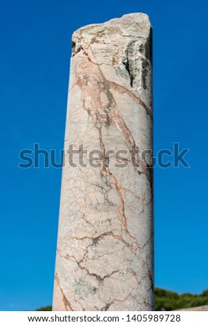 Roman marble broken column on a clear blue sky in Ostia Antica, colony founded in the 7th century BC. Rome, UNESCO world heritage site, Italy, Latium, Europe