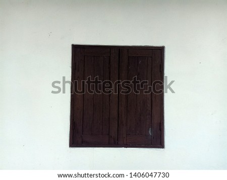 Brown window background on white concrete wall
