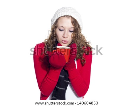 Beautiful young woman having a cup of coffee against white background