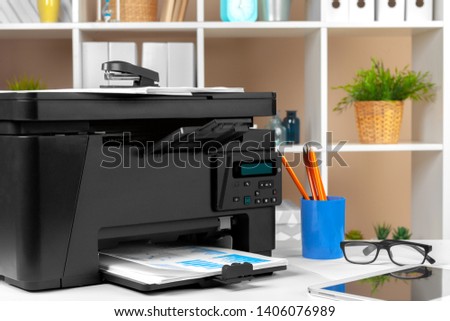 Printer, copier, scanner in office. Workplace. Royalty-Free Stock Photo #1406076989