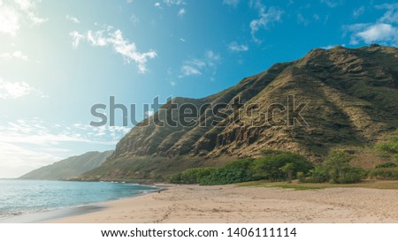 Tropical Makua beach view with mountains and blue sky, Oahu island, Hawaii